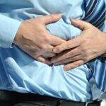 Immagine che illustra i sintomi del tumore al pancreas, evidenziando segnali poco noti.